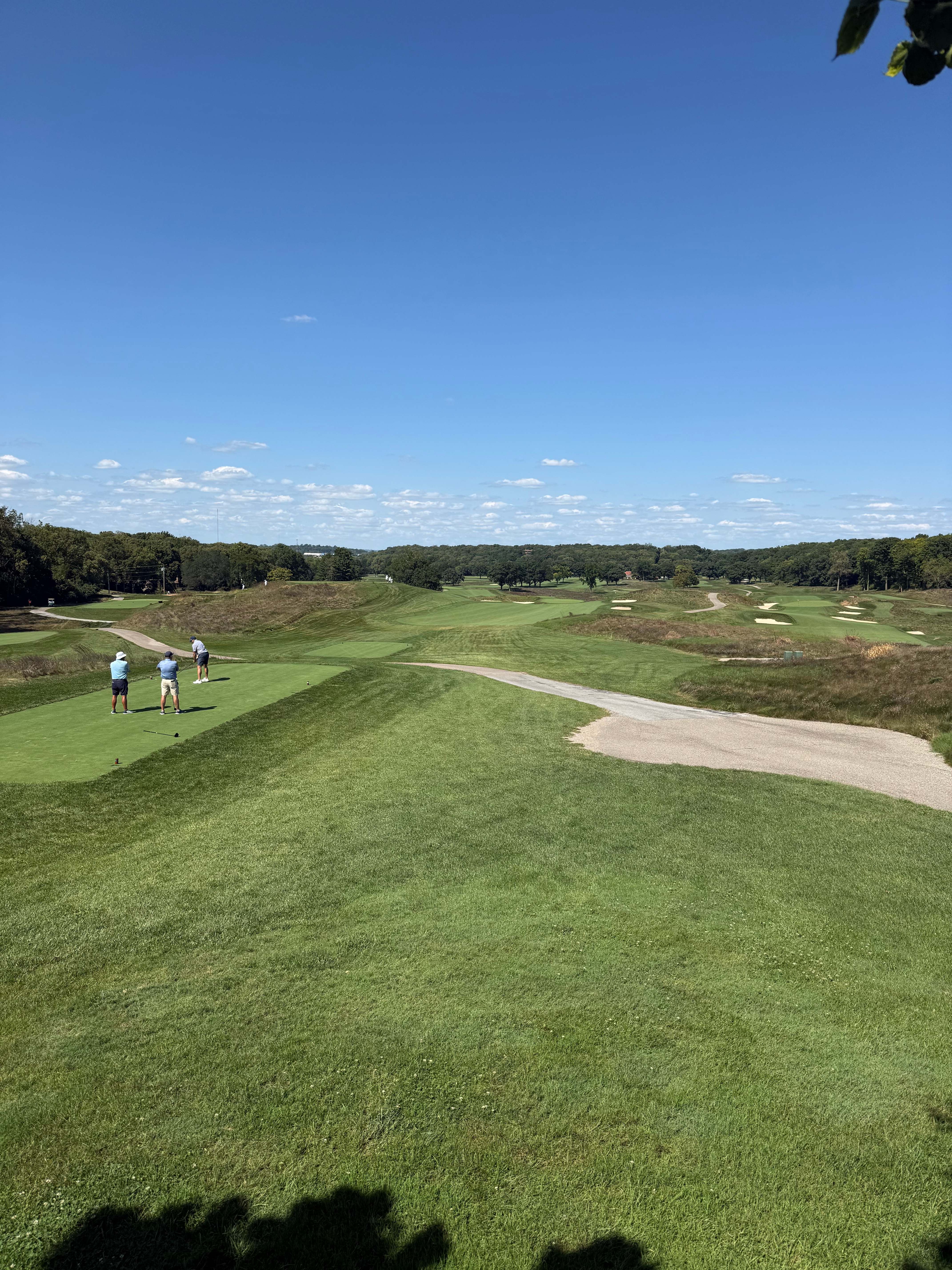 The rolling landscape near Moraine Country Club's 16th hole under a clear blue sky
