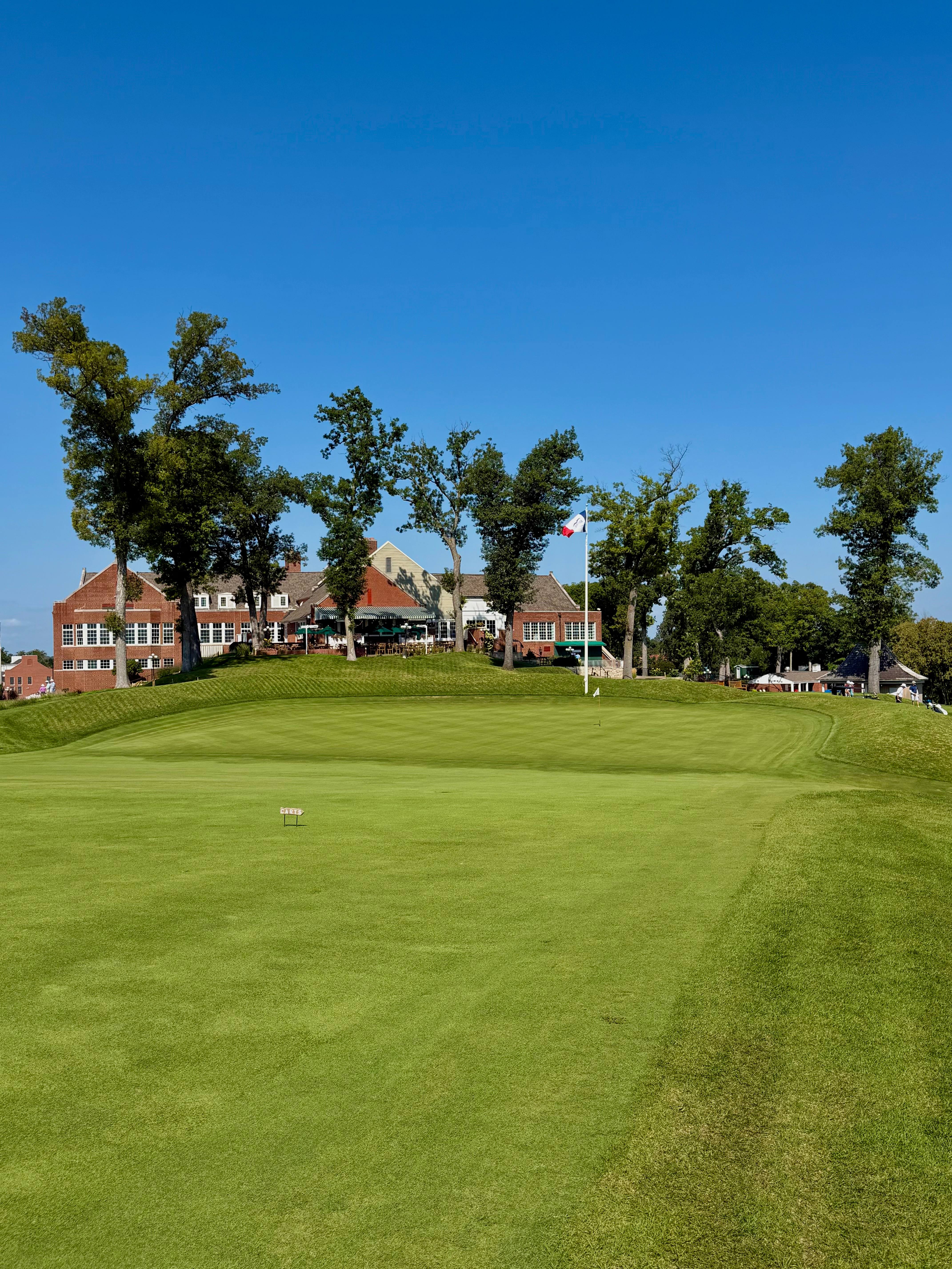 The punchbowl ninth green at Cedar Rapids Country Club below the clubhouse