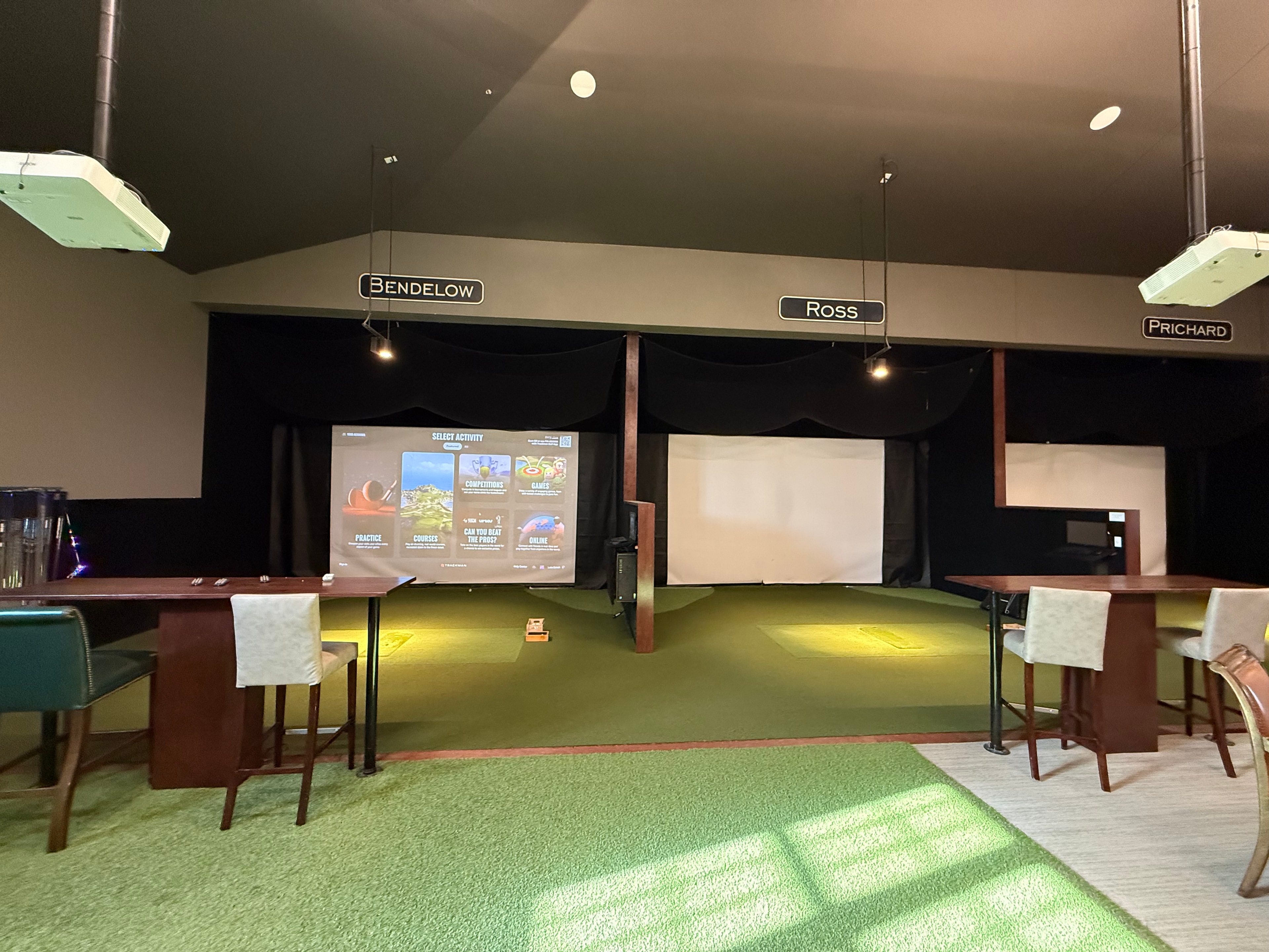 Indoor golf simulators beside the pro shop at Cedar Rapids Country Club